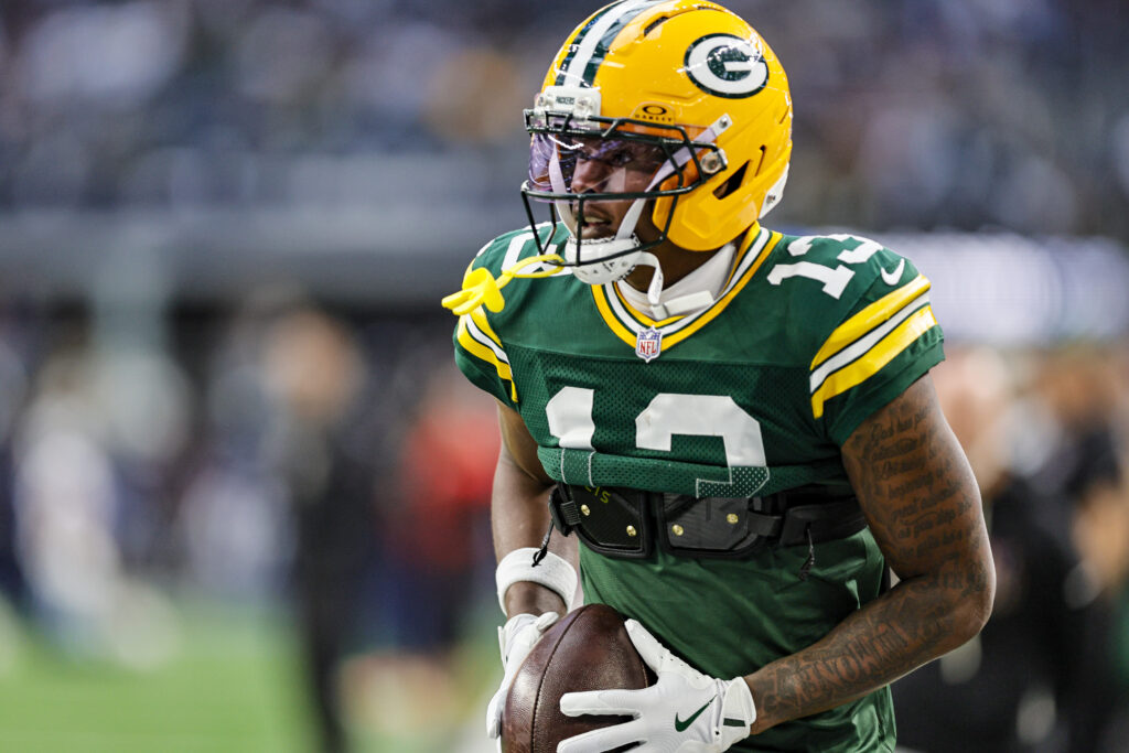 Green Bay Packers wide receiver Dontayvion Wicks (13) warms up before the game between the Dallas Cowboys and the Green Bay Packers on September 28, 2025 at AT&T Stadium.