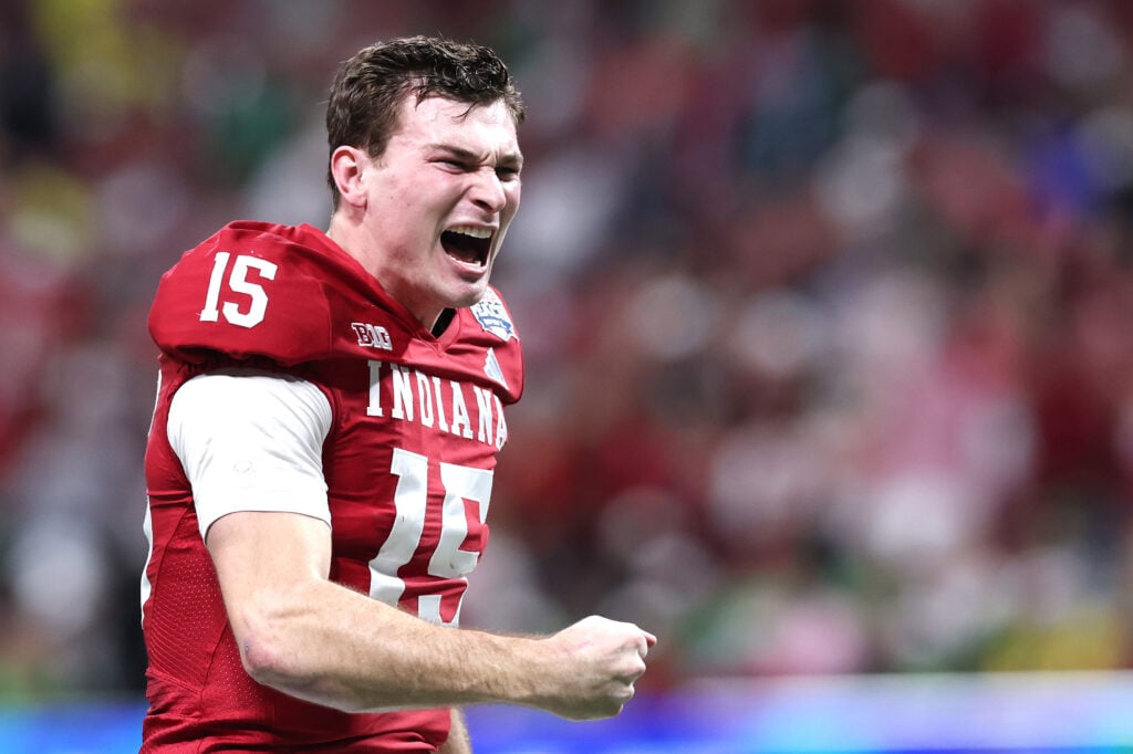Fernando Mendoza #15 of the Indiana Hoosiers celebrates a touchdown pass against the Oregon Ducks during the second quarter in the 2025 College Football Playoff Semifinal at the Chick-fil-A Peach Bowl at Mercedes-Benz Stadium.