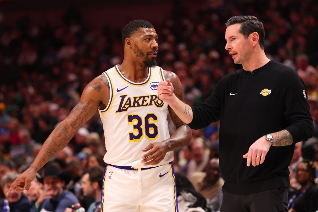 Marcus Smart #36 of the Los Angeles Lakers and head coach JJ Redick talk during the first half of the game against the Dallas Mavericks at American Airlines Center.