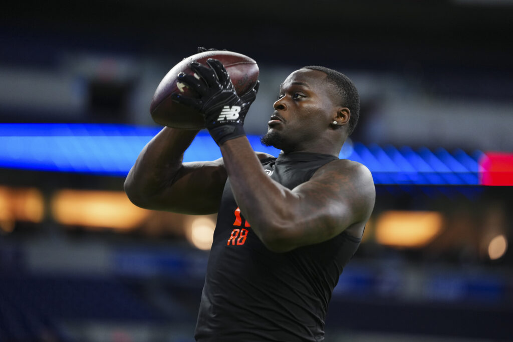 Jeremiyah Love #RB11 of Notre Dame participates in a drill during the 2026 NFL Scouting Combine at Lucas Oil Stadium.