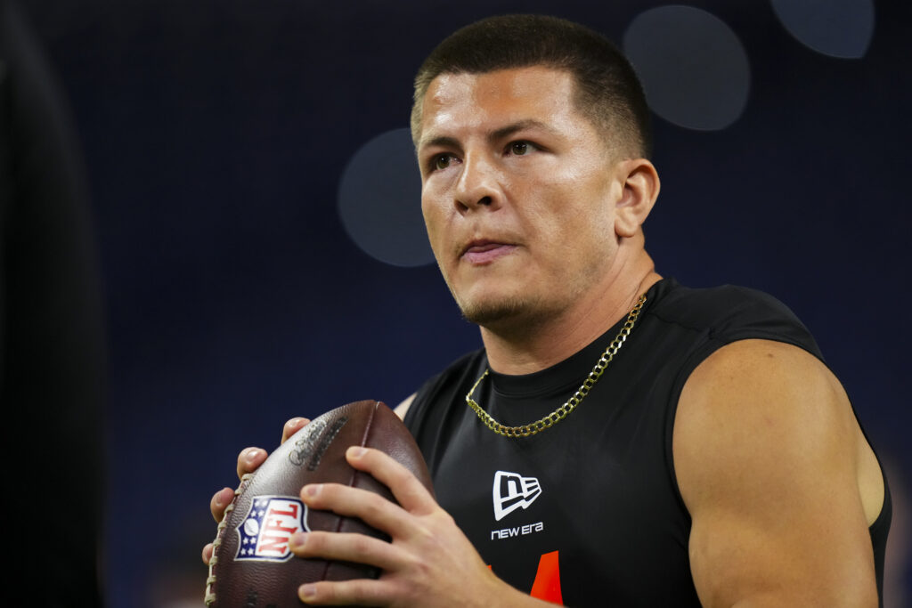 Diego Pavia #QB14 of Vanderbilt participates in a drill during the 2026 NFL Scouting Combine at Lucas Oil Stadium.