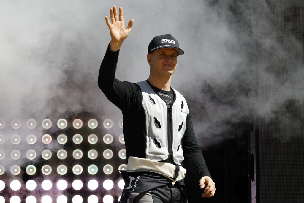 Mick Schumacher waving to fans ahead of the 2026 IndyCar Grand Prix of Phoenix.