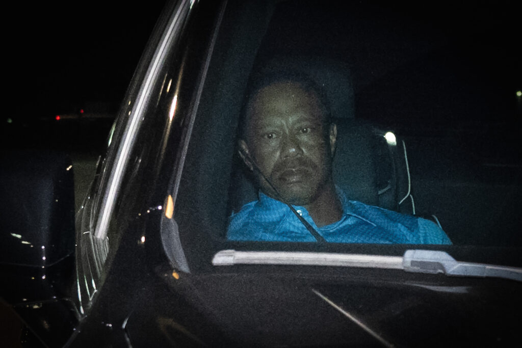 Tiger Woods is seen leaving Martin County Jail after being arrested for driving under the influence after a car crash.