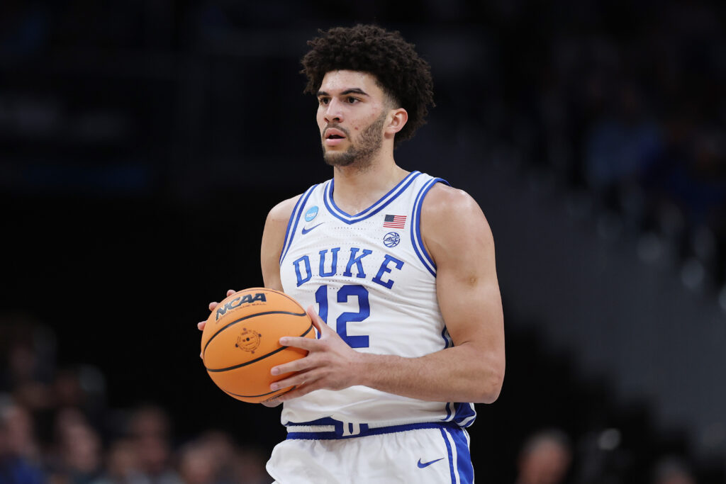 Cameron Boozer #12 of the Duke Blue Devils takes a free throw against the UConn Huskies during the first half of a game in the Elite Eight of the 2026 NCAA Men's Basketball Tournament at Capital One Arena.