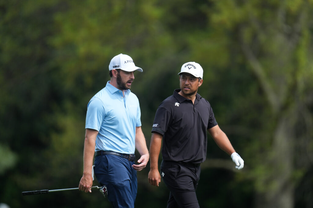 Patrick Cantlay and Xander Schauffele walk along the fifth hole prior to Masters Tournament at Augusta National Golf Club