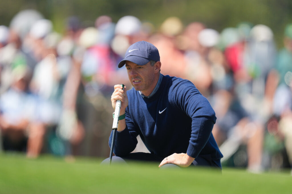 Rory McIlroy of Northern Ireland reads the putt on the 17th green during the first round of Masters Tournament at Augusta National Golf Club