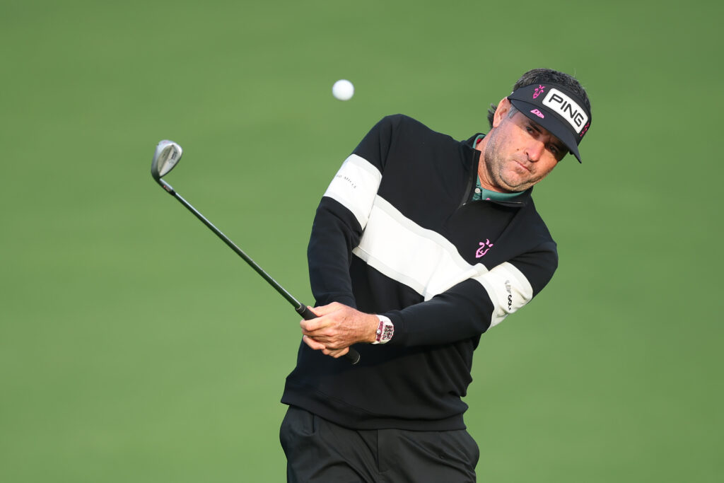 Bubba Watson of the United States chips onto the second green during a practice round prior to the 2026 Masters Tournament at Augusta National