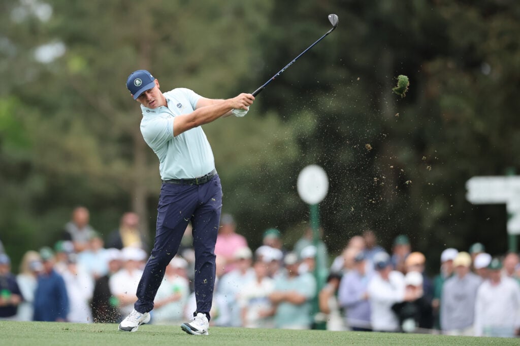 Bryson DeChambeau of the United States plays a shot on the 15th hole during a practice round prior to the 2026 Masters Tournament at Augusta National