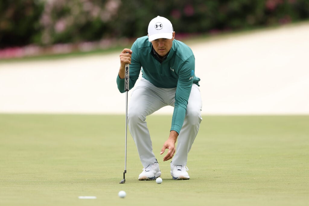 Jordan Spieth lines up a putt during a practice round at Augusta National ahead of The Masters