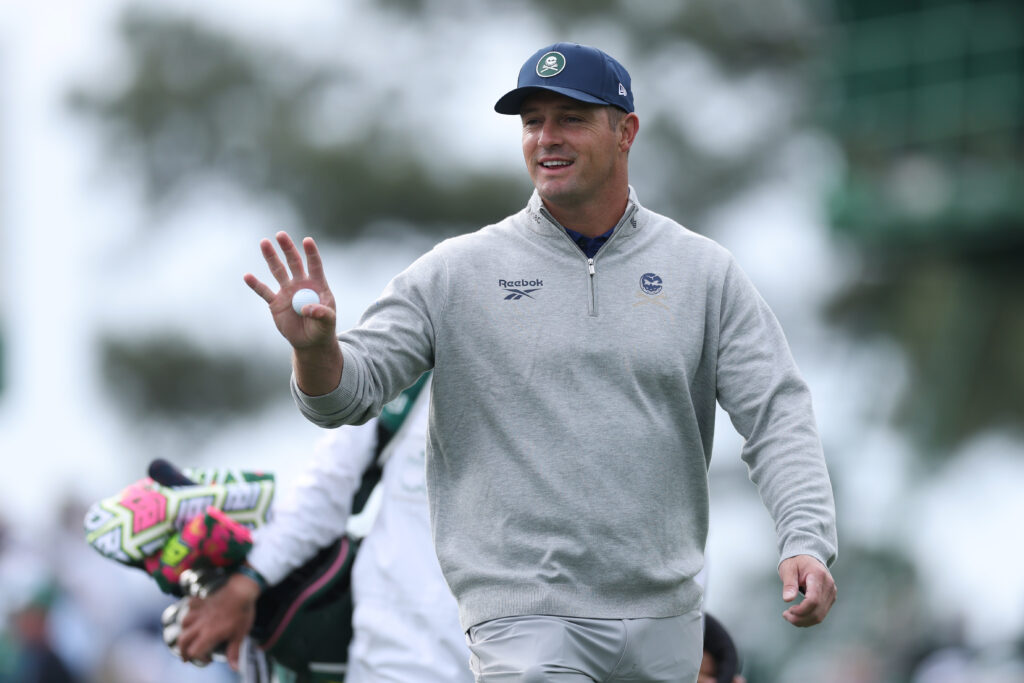Bryson DeChambeau acknowledges the crowd during a practice round ahead of The Masters