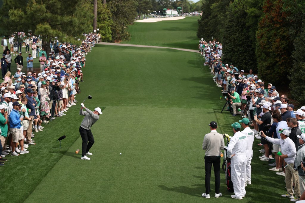 Rory McIlroy of Northern Ireland plays a shot from the 18th hole tee box during a practice round prior to the 2026 Masters Tournament at Augusta National Golf Club