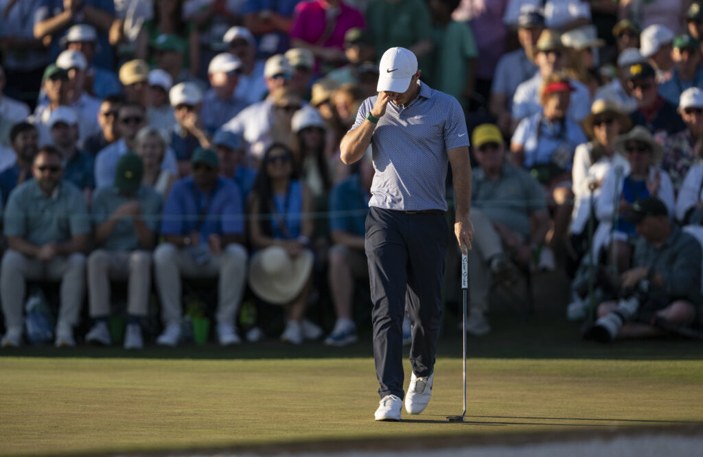 Masters champion Rory McIlroy of Northern Ireland reacts after a missed putt on the No. 18 hole during the third round of the Masters at Augusta National Golf Club