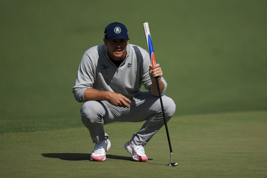 Bryson DeChambeau lines up a putt during the first round of The Masters