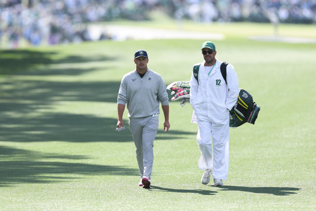 Bryson DeChambeau walks down the first fairway during the first round of The Masters