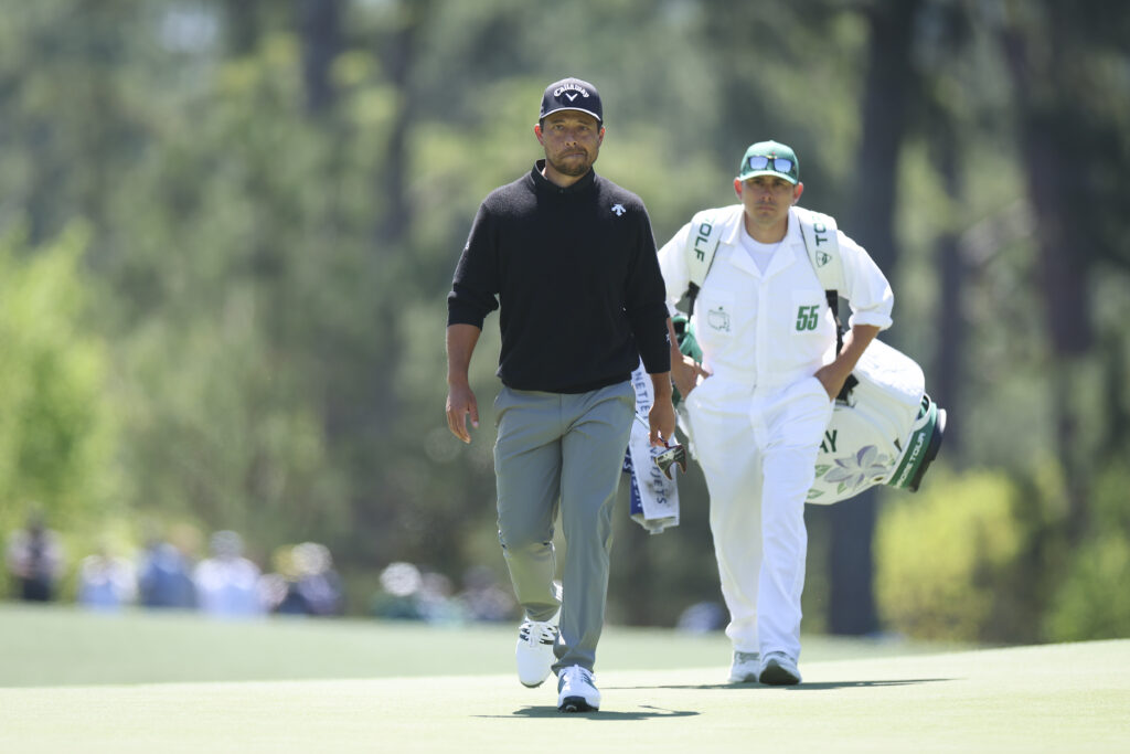 Xander Schauffele walks the eighth fairway with his caddie Austin Kaiser during the first round of the 2026 Masters Tournament at Augusta National Golf Club