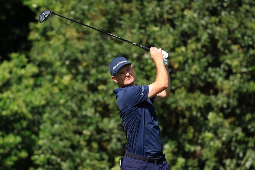 Justin Rose hits a tee shot during the final round of The Masters