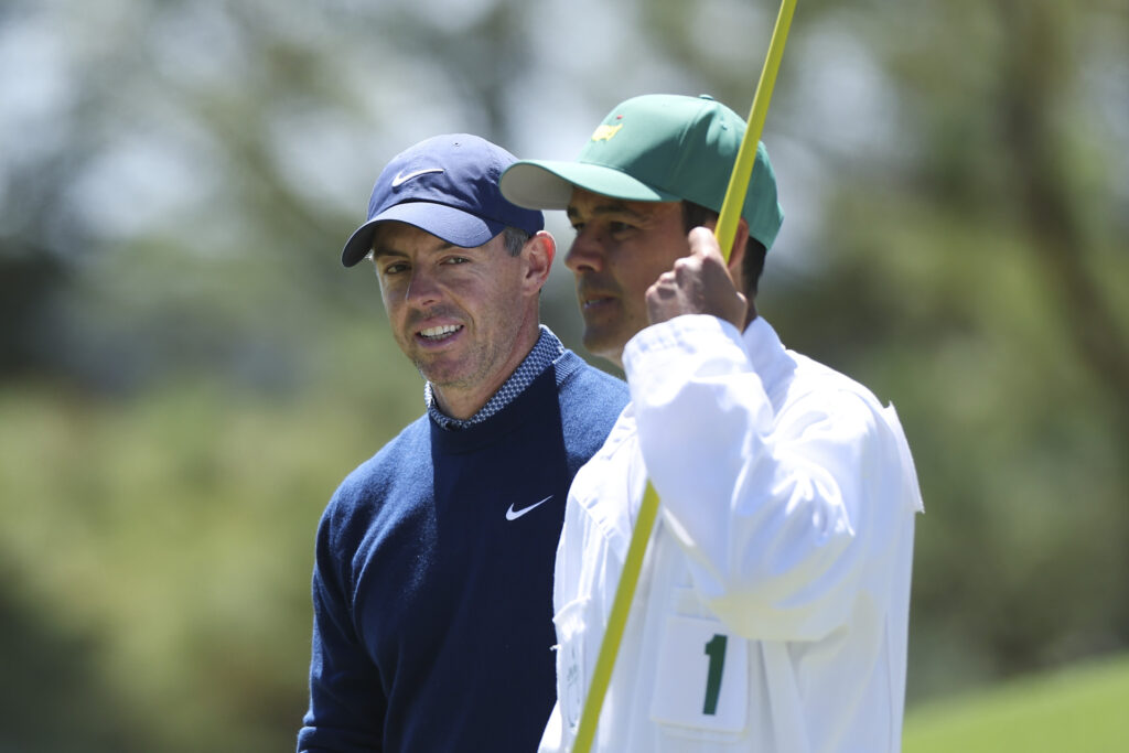 Rory McIlroy and his caddie Harry Diamond looks on while playing the eighth hole during the first round of the 2026 Masters Tournament at Augusta National Golf Club