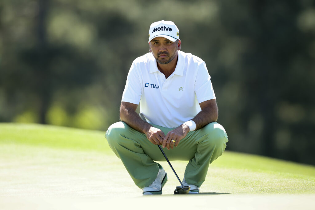 Jason Day reads a putt during the first round of The Masters