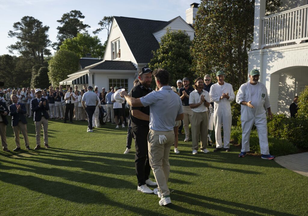 Shane Lowry congratulates Rory McIlroy after the Northern Irishman wins The Masters for a second year