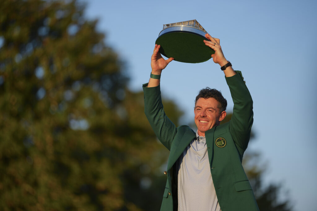 Rory McIlroy of Northern Ireland holds the trophy wearing his Green Jacket at the presentation after the final round of Masters Tournament at Augusta National Golf Club