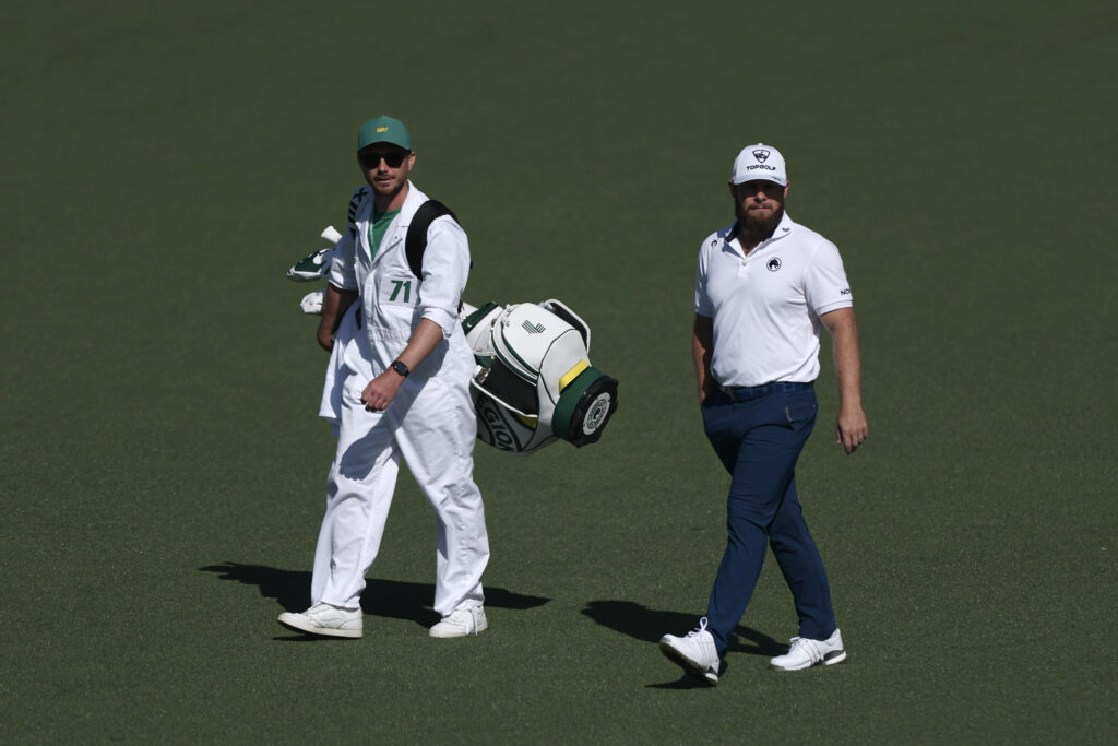 Tyrrell Hatton walks with his caddie Hugo Dobson up the second hole during the second round of the 2026 Masters Tournament at Augusta National Golf Club
