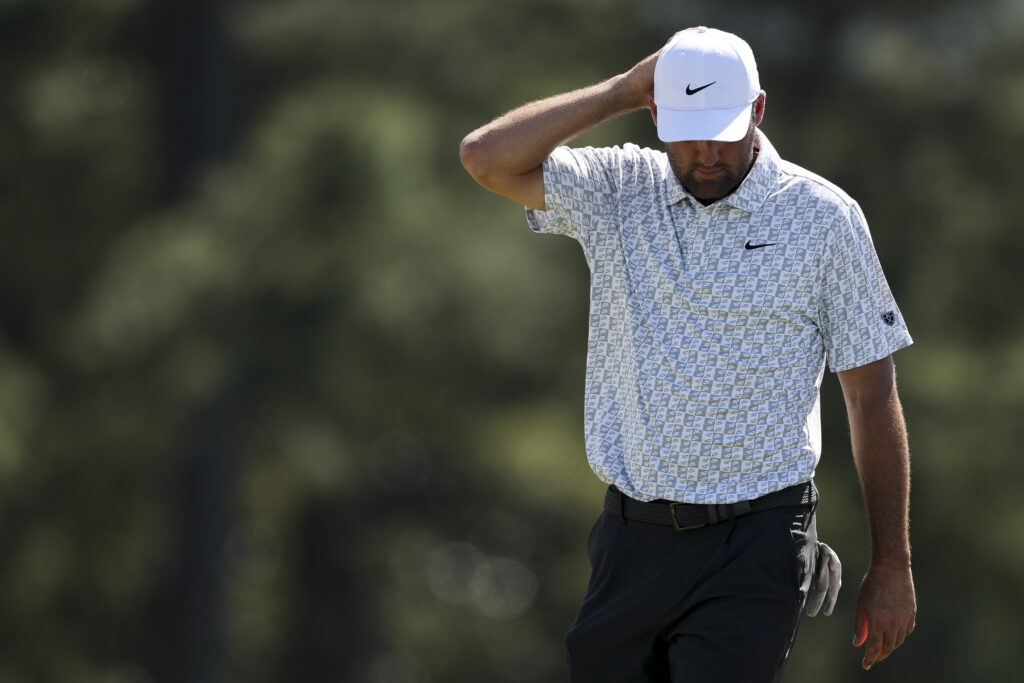 Scottie Scheffler of the United States reacts on the 18th green during the second round of the 2026 Masters Tournament at Augusta National Golf Club