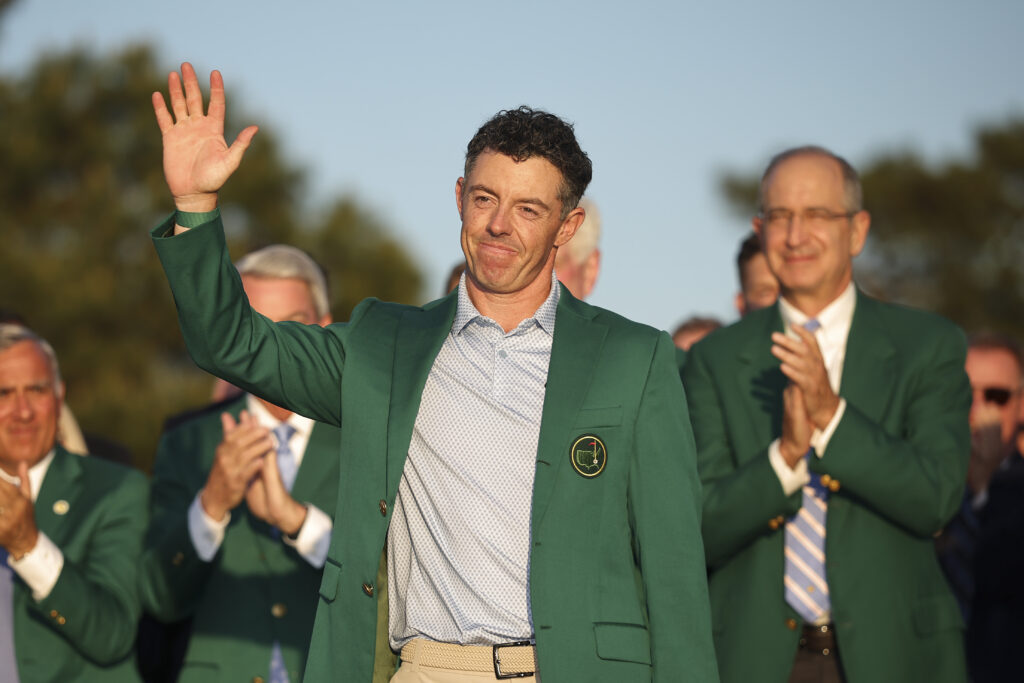 Rory McIlroy of Northern Ireland reacts after being awarded the Green Jacket during the Green Jacket Ceremony after winning the final round of the 2026 Masters Tournament at Augusta National Golf Club