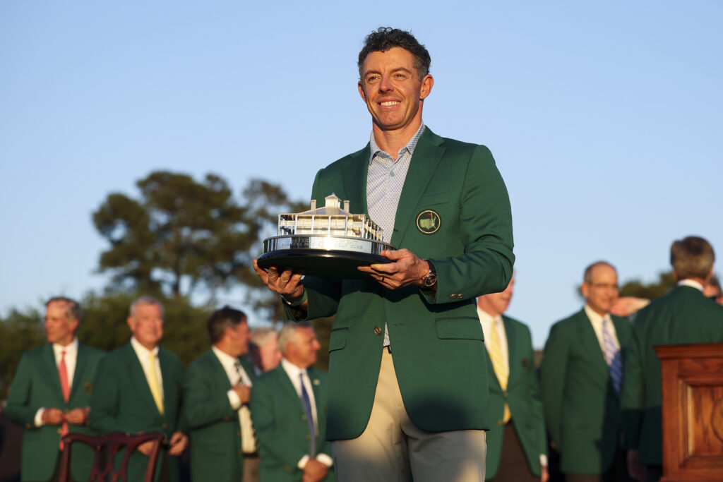 Rory McIlroy of Northern Ireland poses with the Masters Trophy during the Green Jacket Ceremony after winning the final round of the 2026 Masters Tournament at Augusta National