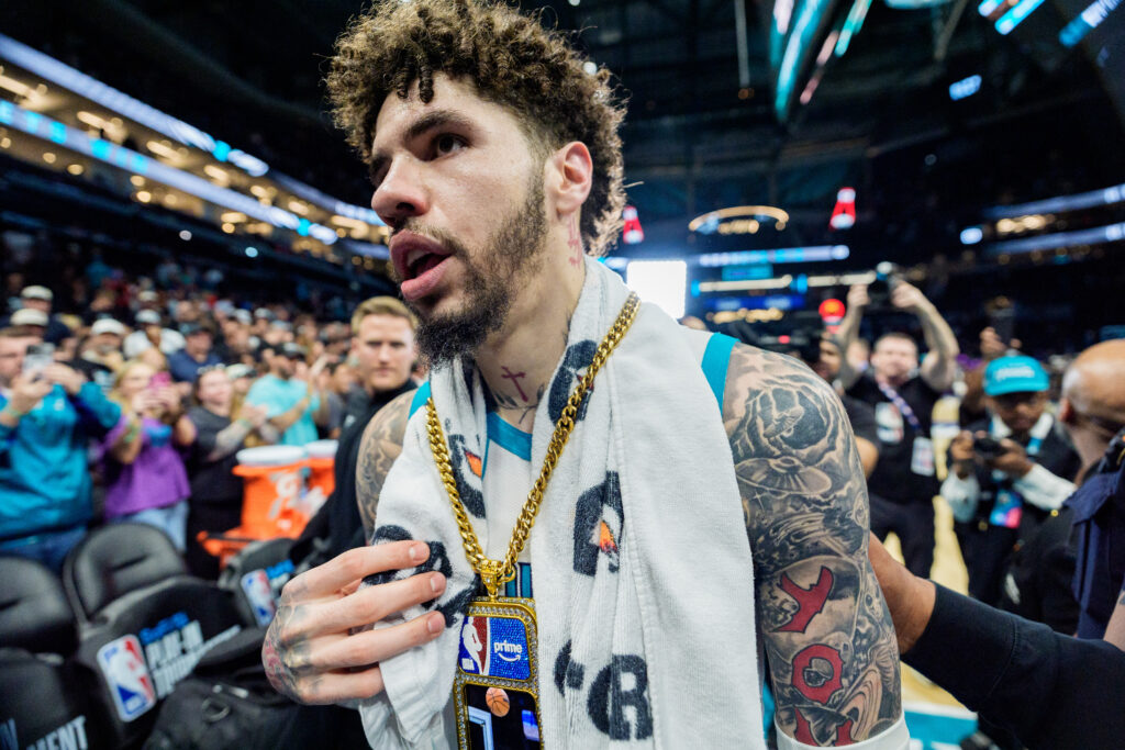 LaMelo Ball #1 of the Charlotte Hornets walks off the court after defeating the Miami Heat during their game at Spectrum Center.