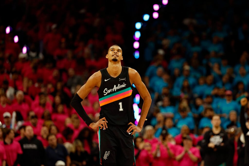 Victor Wembanyama #1 of the San Antonio Spurs looks at the clock during the closing minutes of the second half of Game One of the Western Conference First Round NBA Playoffs against the Portland Trailblazers at Frost Bank Center.