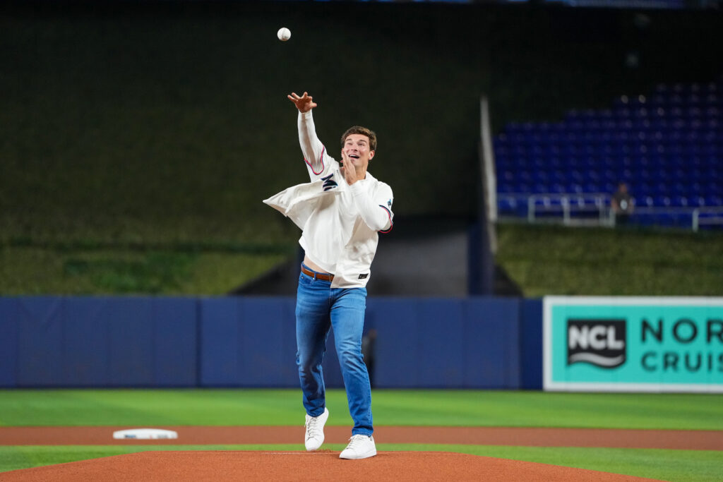 Fernando Mendoza delivers the ceremonial first pitch prior to the game between the St. Louis Cardinals and the Miami Marlins at LoanDepot park.
