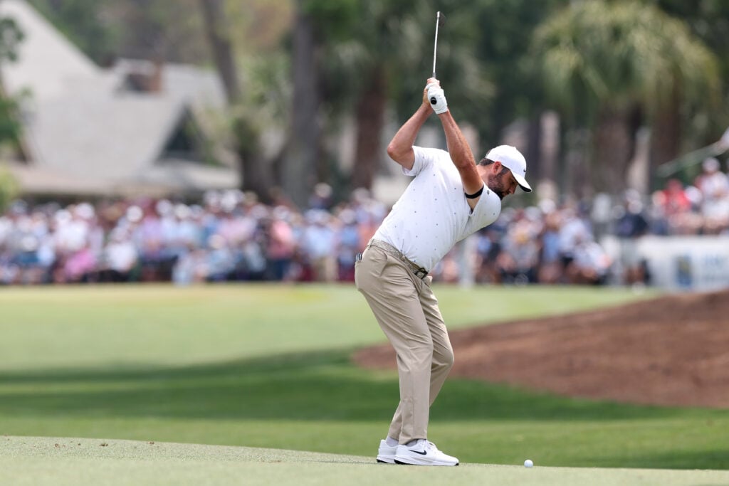 Scottie Scheffler plays a shot on the first hole during the third round of the RBC Heritage 2026 at Harbour Town Golf Links
