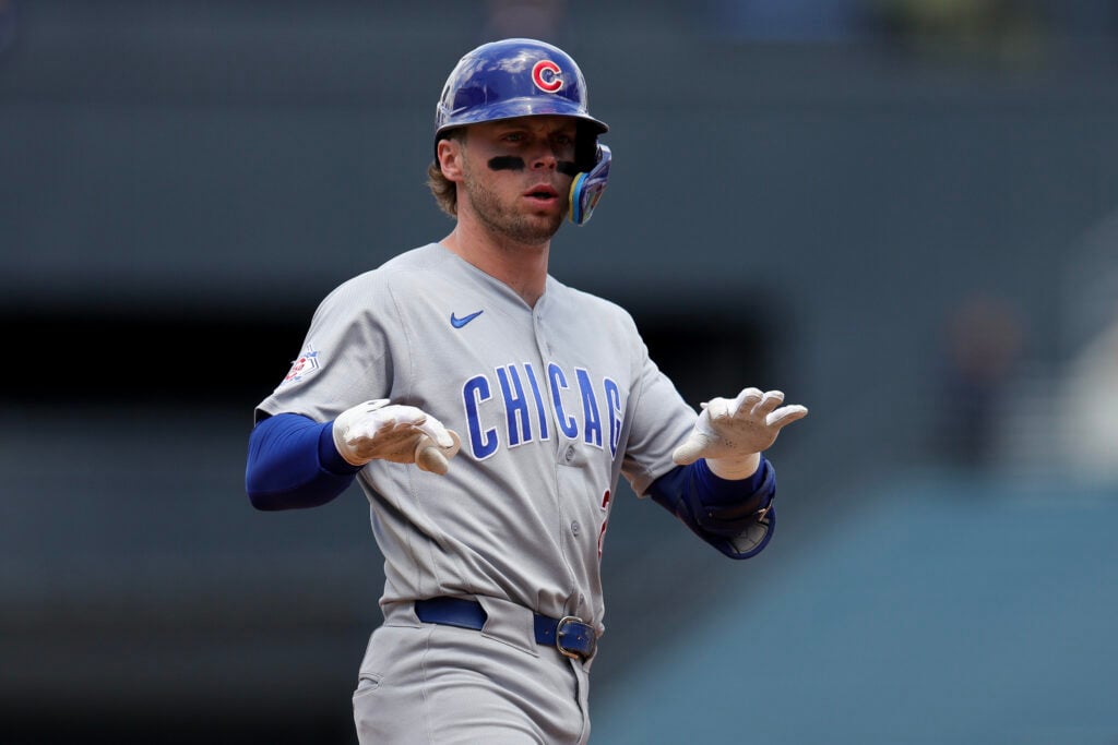 Nico Hoerner #2 of the Chicago Cubs reacts after hitting a single during the first inning of a baseball game against the Los Angeles Dodgers at Dodger Stadium.