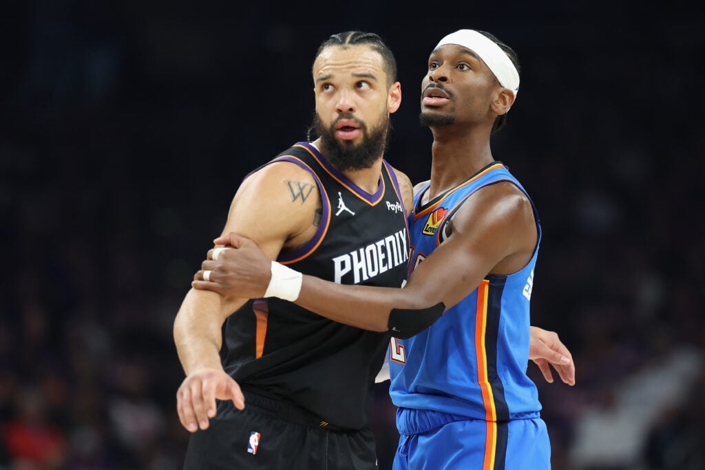 Dillon Brooks #3 of the Phoenix Suns and Shai Gilgeous-Alexander #2 of the Oklahoma City Thunder during the first half in Game Three of the Western Conference First Round NBA Playoffs at Mortgage Matchup Center.