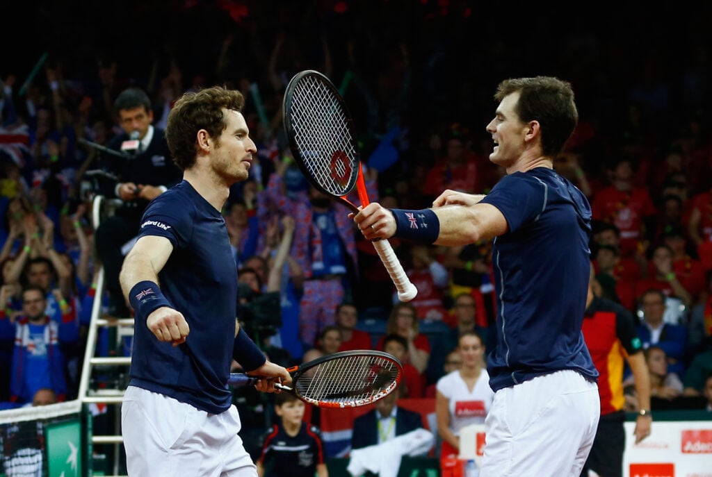 Jamie Murray and Andy Murray of Great Britain celebrate defeating Steve Darcis and David Goffin of Belgium in the doubles during day two of the Davis Cup Final between Belgium and Great Britain at Flanders Expo on November 28, 2015 in Ghent, Belgium.