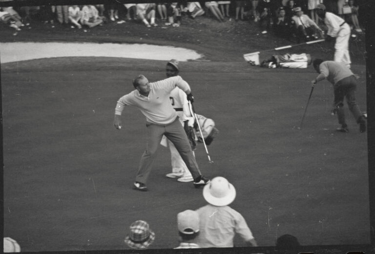 (Original Caption) Augusta, Ga.: Jack Nicklaus tosses his golf ball down the 18th fairway after holing out to win the 1966 Masters in playoff again...