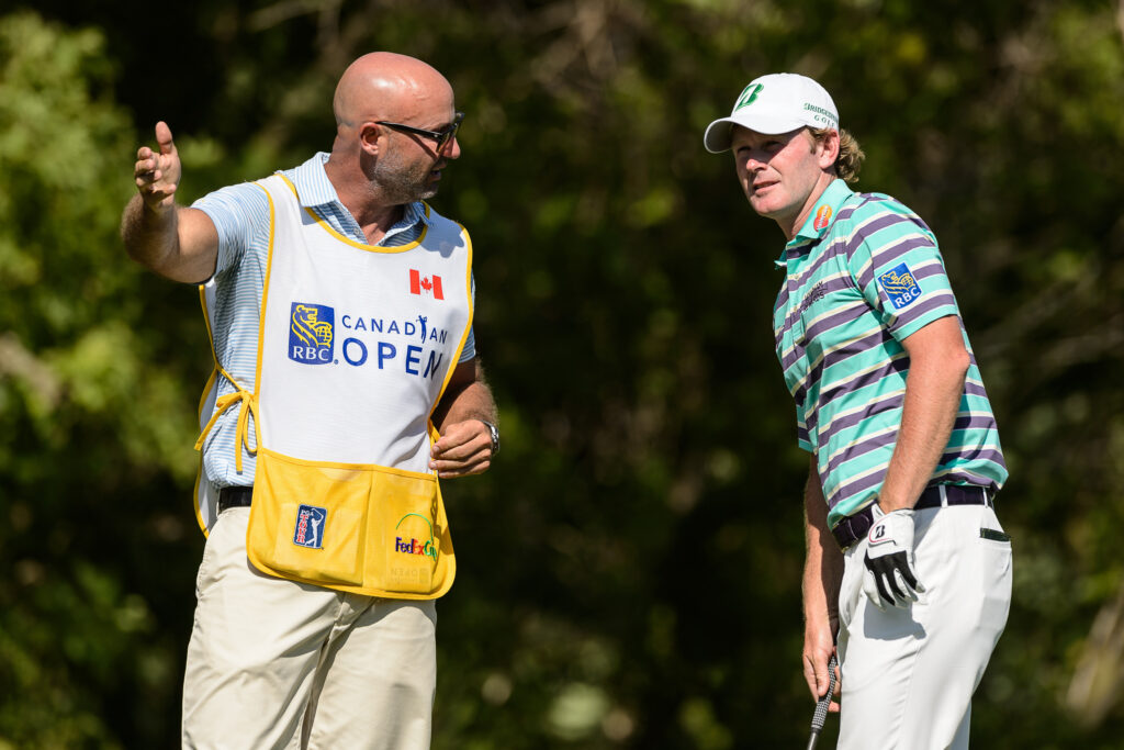 Scott Vail and Brandt Snedeker discuss a shot during the second round of the Canadian Open