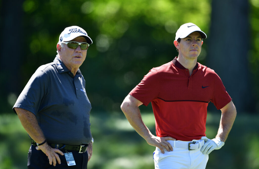 Rory McIlroy talks with Butch Harmon during a practice round prior to the 2016 PGA Championship at Baltusrol
