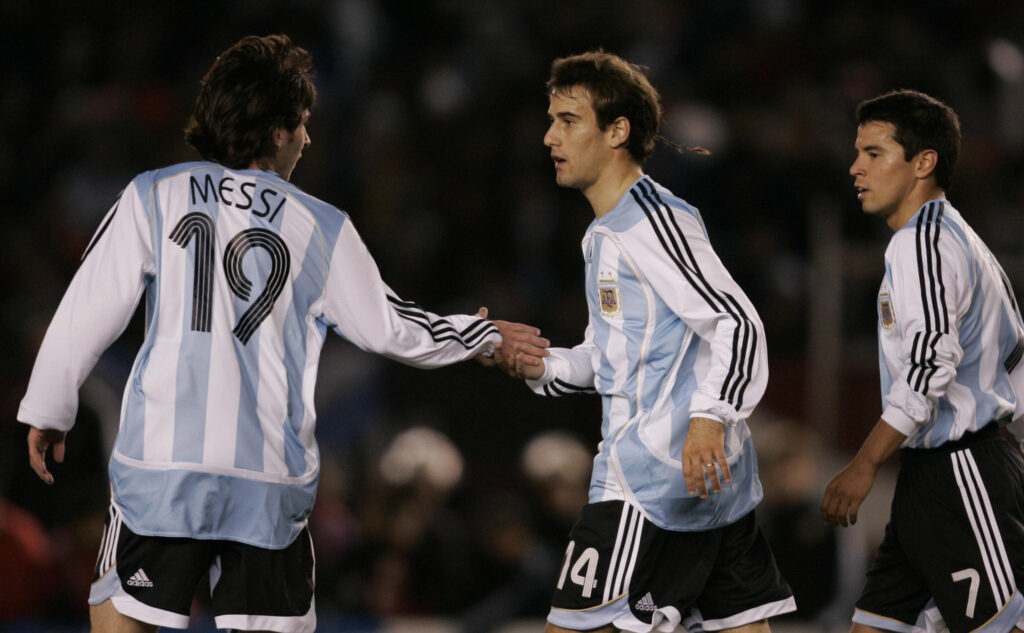 Argentine National Soccer team player Rodrigo Palacio (C) celebrates with teammates Lionel Messi (L) and Javier Saviola after scoring a goal against Argentine U-20 National team during a training match before leave the country to take part at the FIFA World Cup Germany 2006.