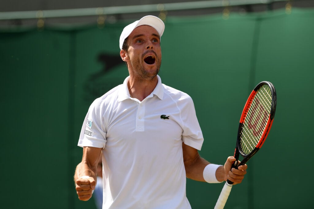 Roberto Bautista Agut of Spain celebrates victory during the Gentlemen's Singles third round match against Kei Nishikori of Japan on day five of the Wimbledon Lawn Tennis Championships at the All England Lawn Tennis and Croquet Club on July 7, 2017 in London, England.