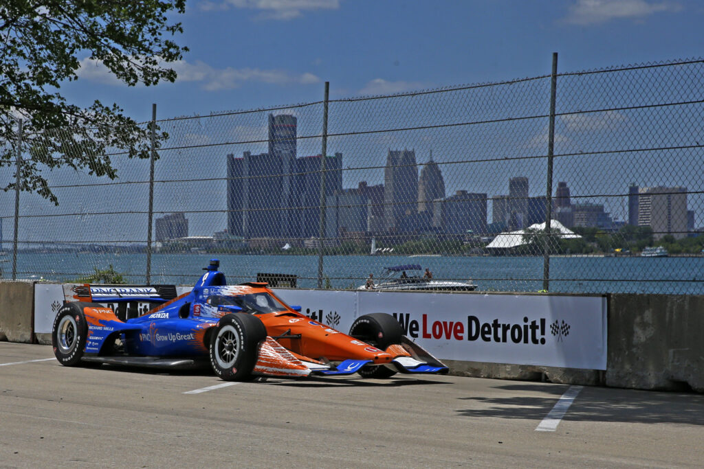 Indy Car series driver Scott Dixon (9) drives along the Detroit River with the Detroit city skyline in the background during the Chevrolet Detroit Grand Prix Race 2 on June 13, 2021 at the Raceway at Belle Isle Park in Detroit, Michigan.