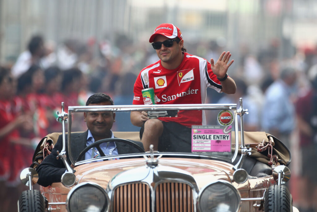 Felipe Massa of Brazil and Ferrari attends the drivers parade before the Indian Formula One Grand Prix at the Buddh International Circuit on October 30, 2011 in Noida, India.