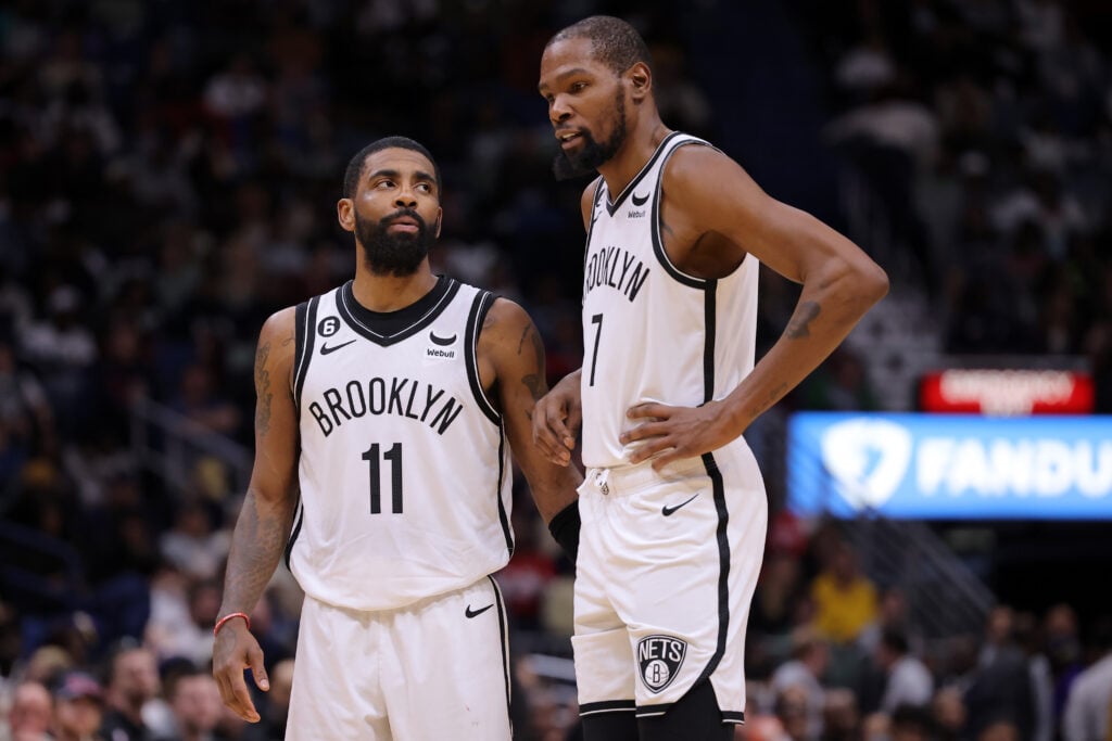 Kevin Durant #7 and Kyrie Irving #11 of the Brooklyn Nets react during a game against the New Orleans Pelicans at the Smoothie King Center.