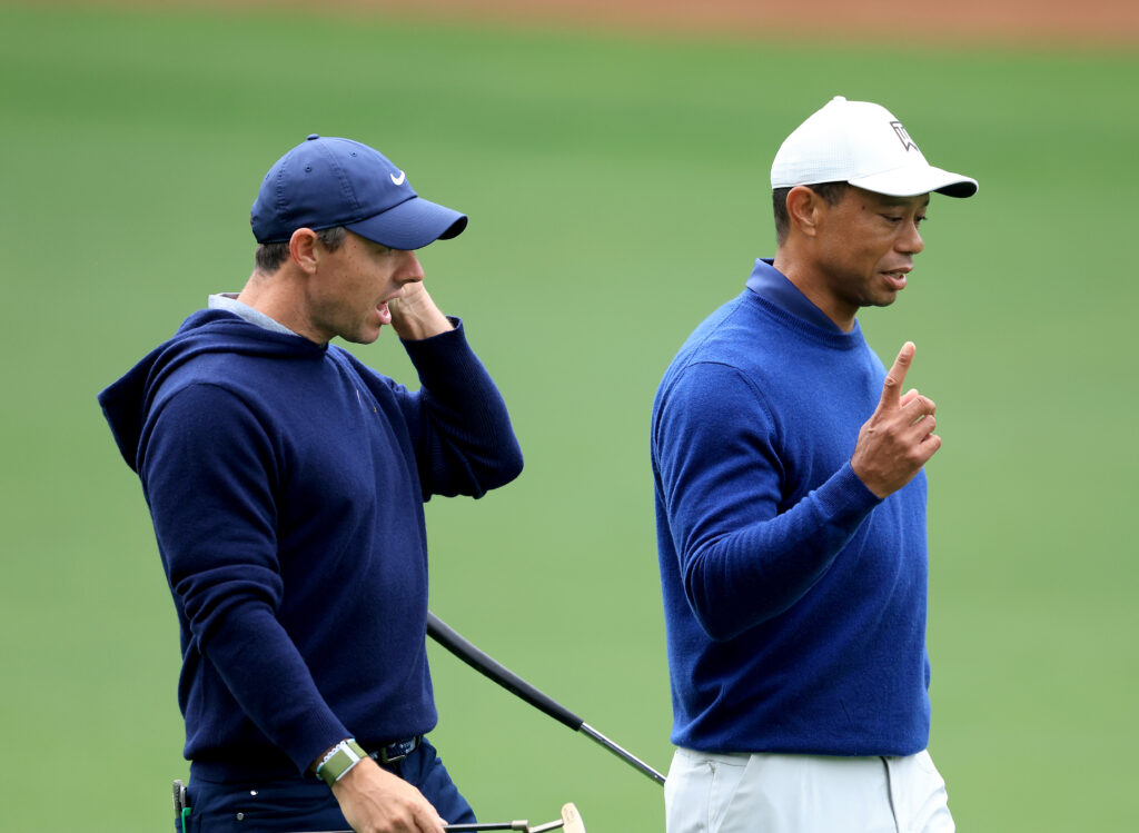 Rory McIlroy and Tiger Woods during a practice round prior to the 2023 Masters at Augusta National