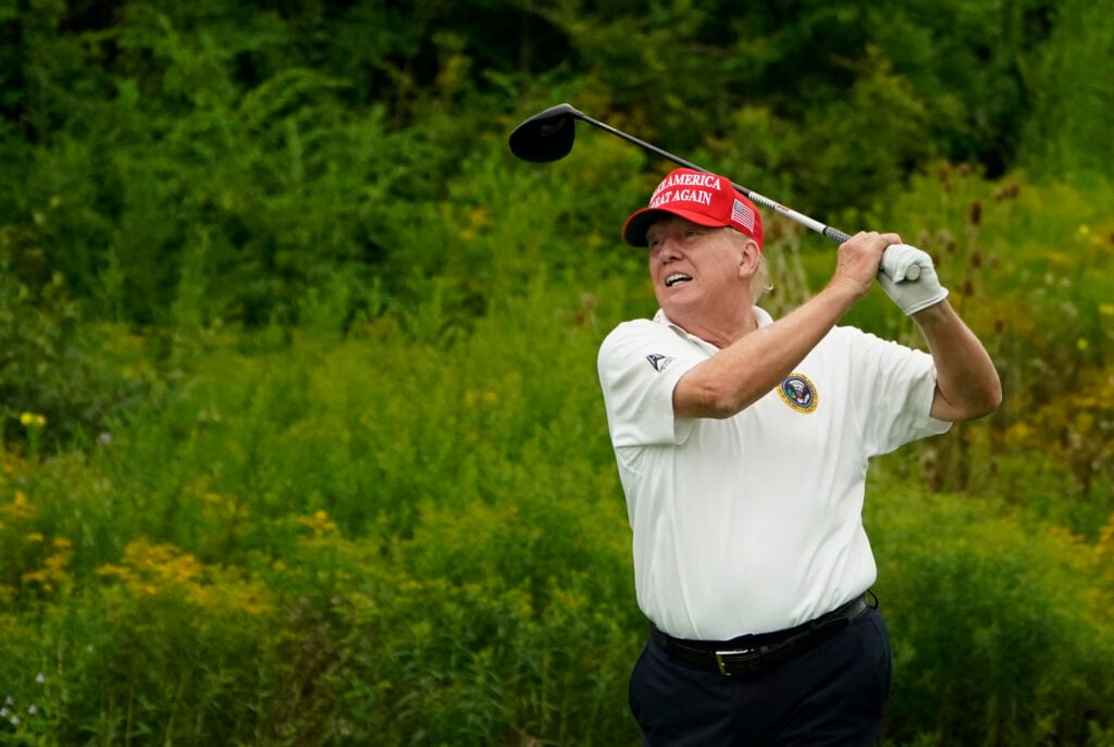 Former US President and 2024 Presidential hopeful Donald Trump plays golf during the Official Pro-Am Tournament ahead of the LIV Golf Invitational Series event at Trump National Golf Club Bedminster.