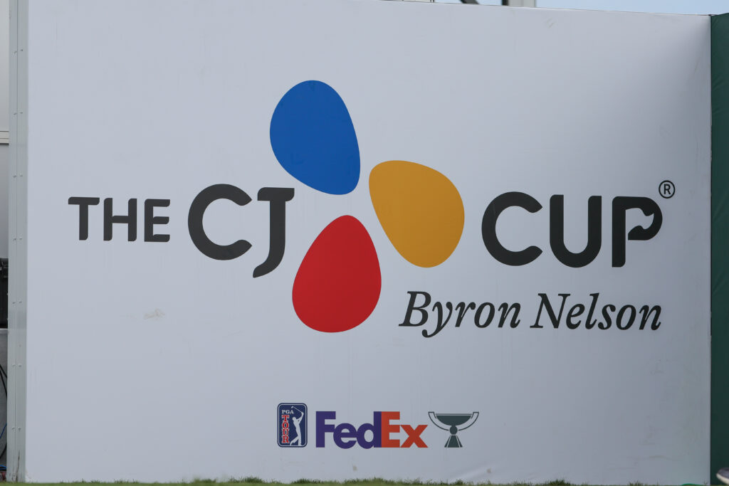 The CJ Cup Byron Nelson logo is displayed behind the 18th tee box during the first round of the CJ Cup Byron Nelson at TPC Craig Ranch in 2024