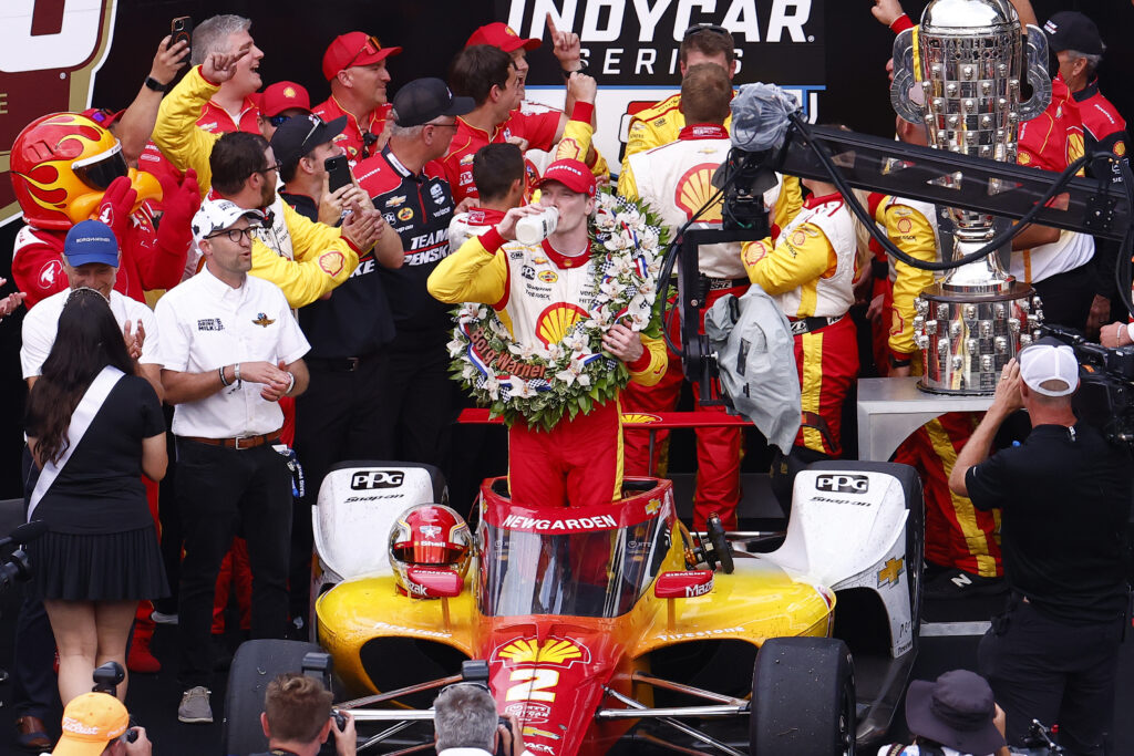 Josef Newgarden of USA (2) driving for Team Penske takes a drink of the winners milk after winning the NTT IndyCar Series 108th Running of the Indianapolis 500 on May 26, 2024 at the Indianapolis Motor Speedway in Indianapolis, IN.