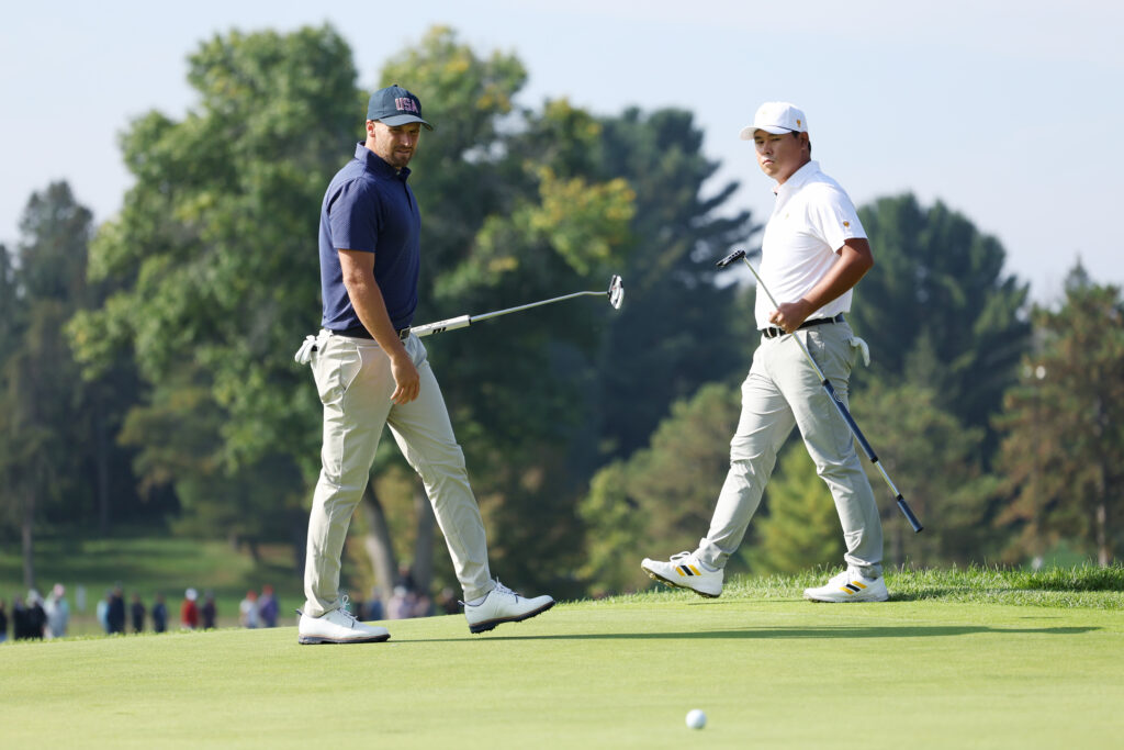 Wyndham Clark and Si Woo Kim in action during the Four-Ball matches at the 2024 Presidents Cup at The Royal Montreal Golf Club