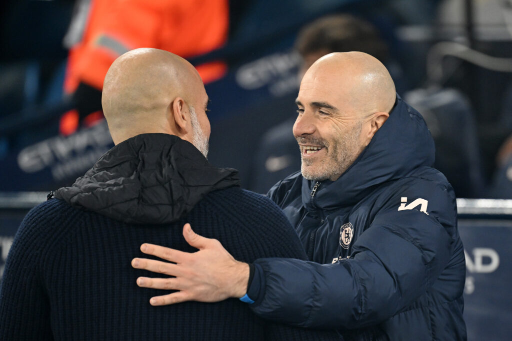 Enzo Maresca, Manager of Chelsea, embraces Pep Guardiola, Manager of Manchester City, prior to the Premier League match between Manchester City FC and Chelsea FC at Etihad Stadium.