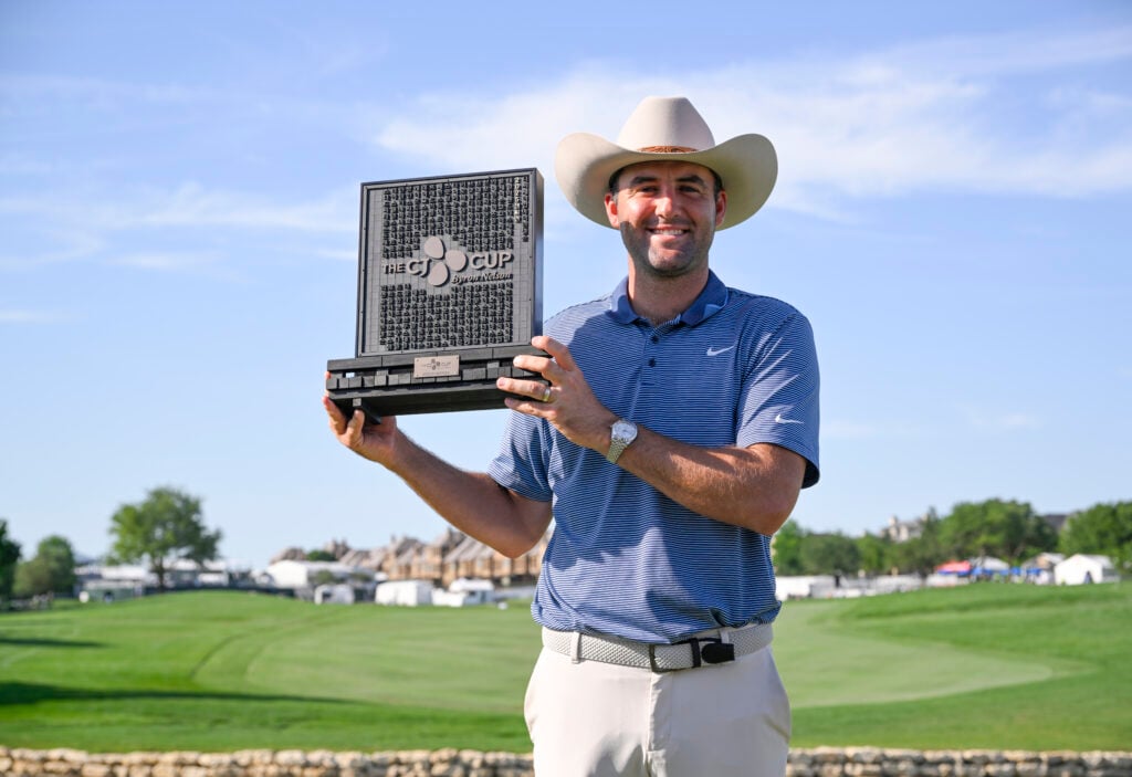 Scottie Scheffler holds the trophy after winning the CJ CUP Byron Nelson